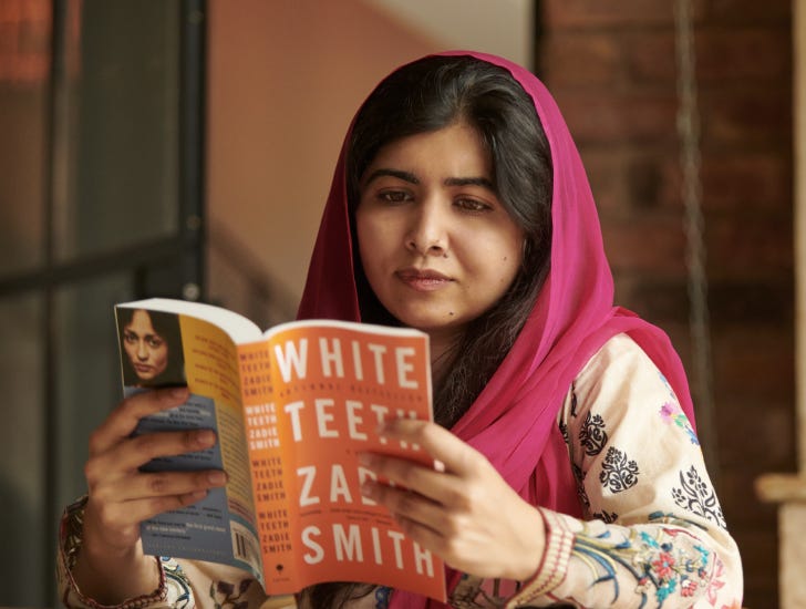 Malala reading a book